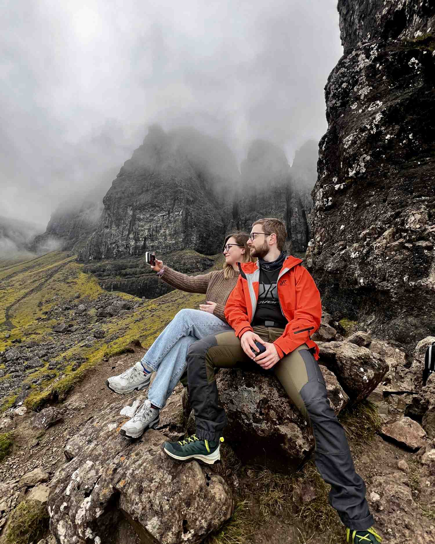 couple taking selfie next to old man of storr Isle of Skye