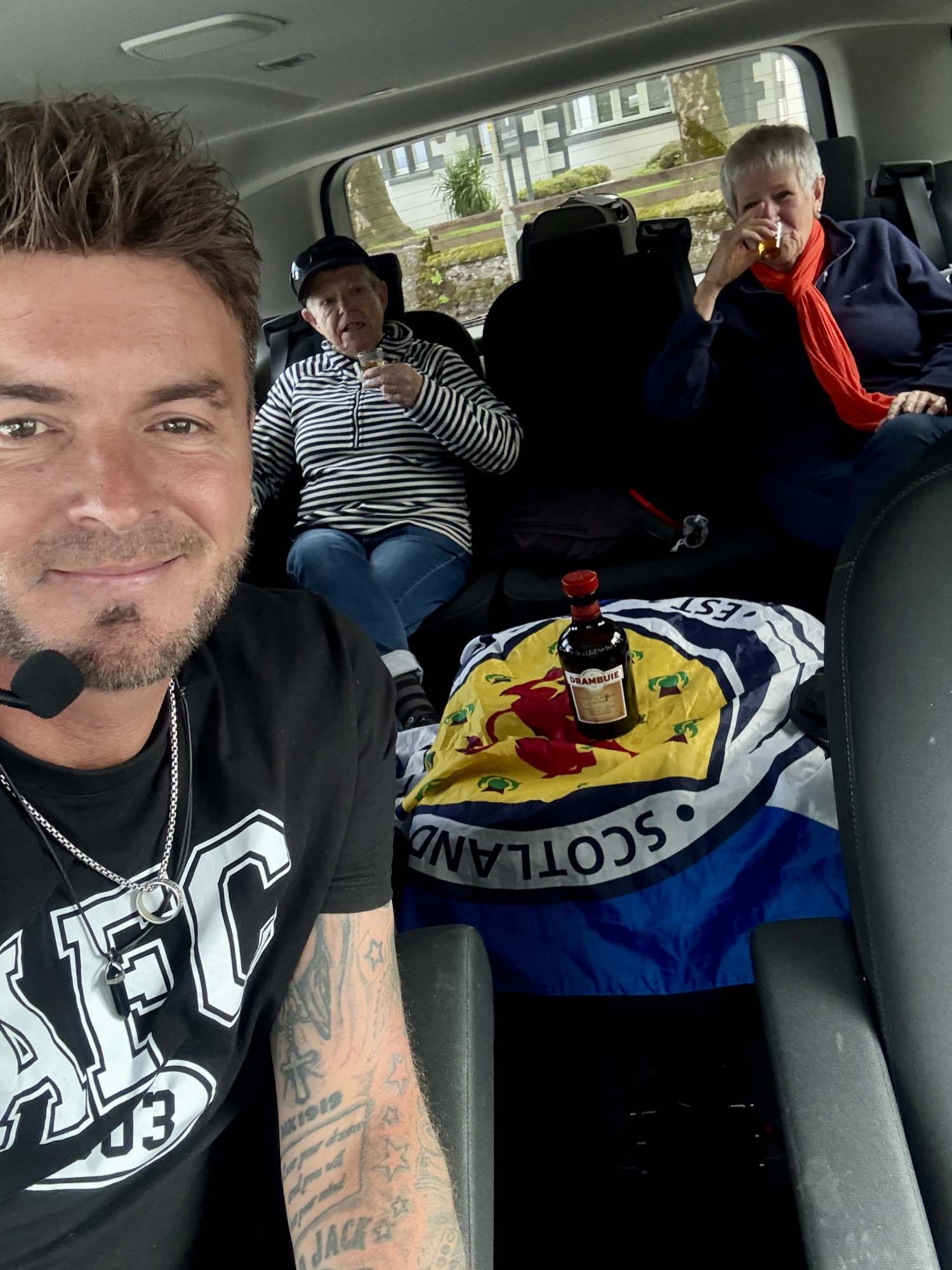 couple enjoying Drambuie in tour vehicle Isle of Skye