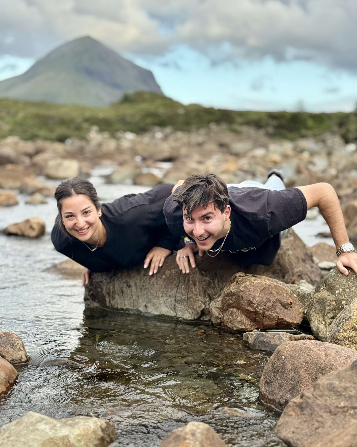 guests dipping faces in magical fairy water Isle of Skye