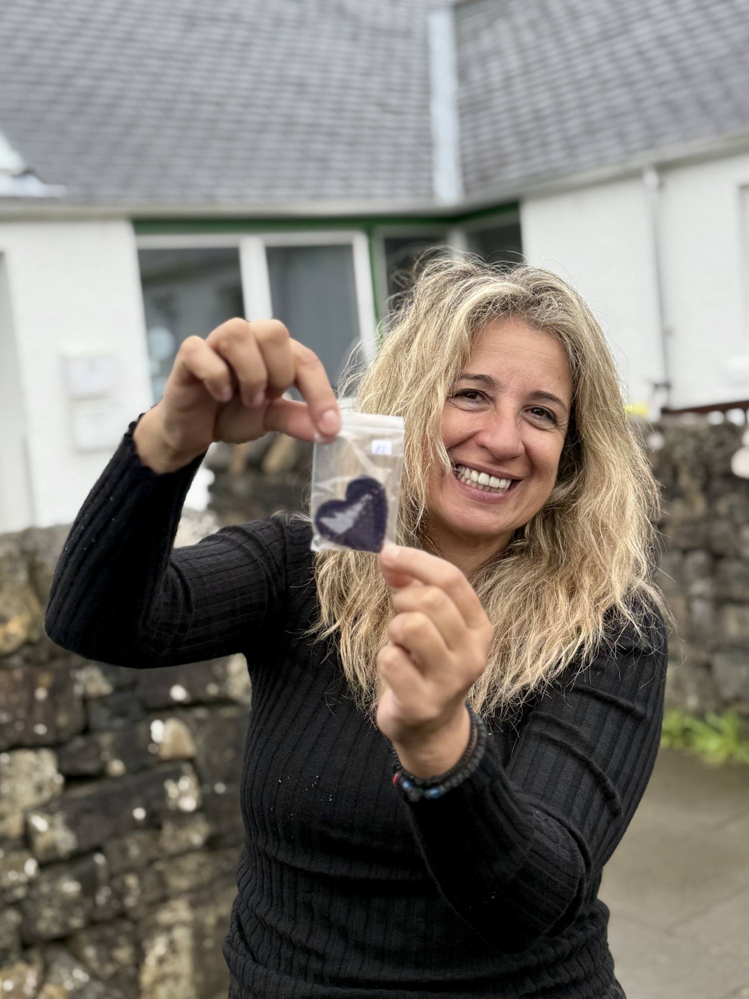 guest holding Isle of Skye keepsake during tour