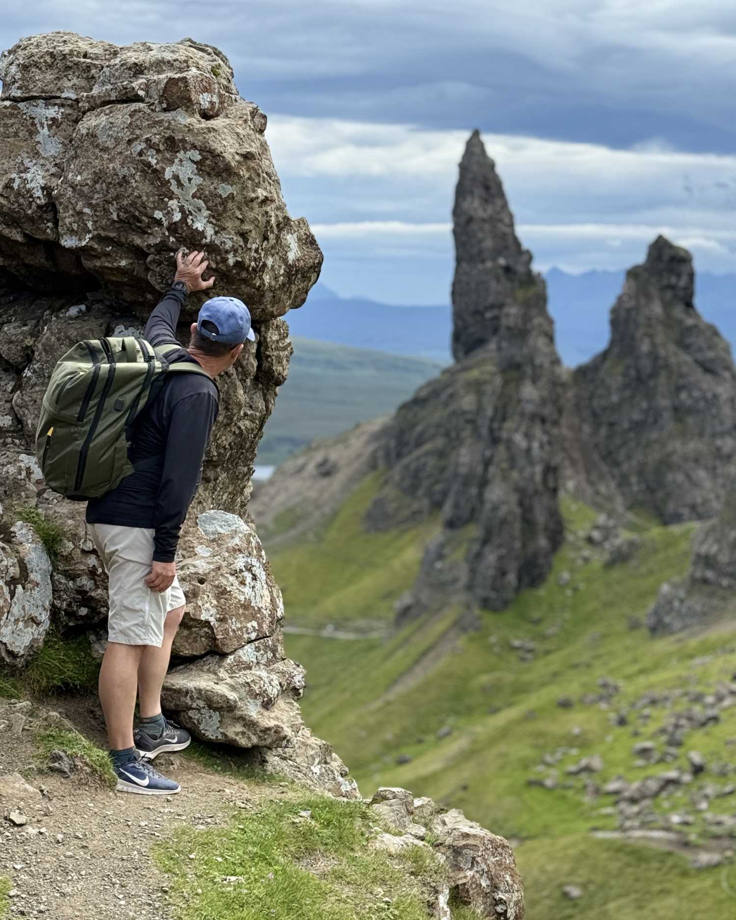 tourist discovering hidden old man of storr viewpoint