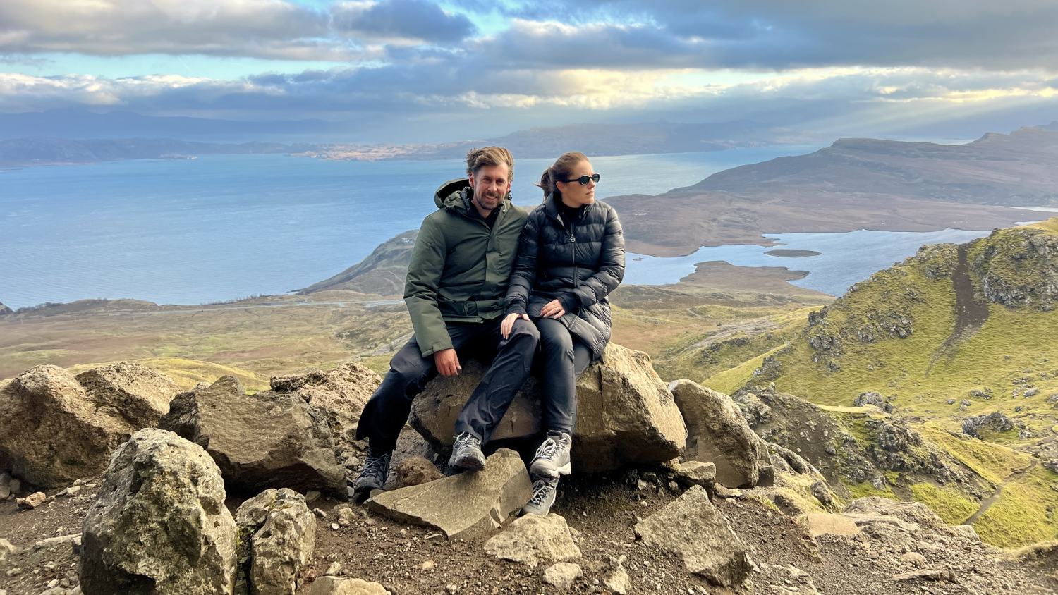 guests sitting at old man of storr viewpoint