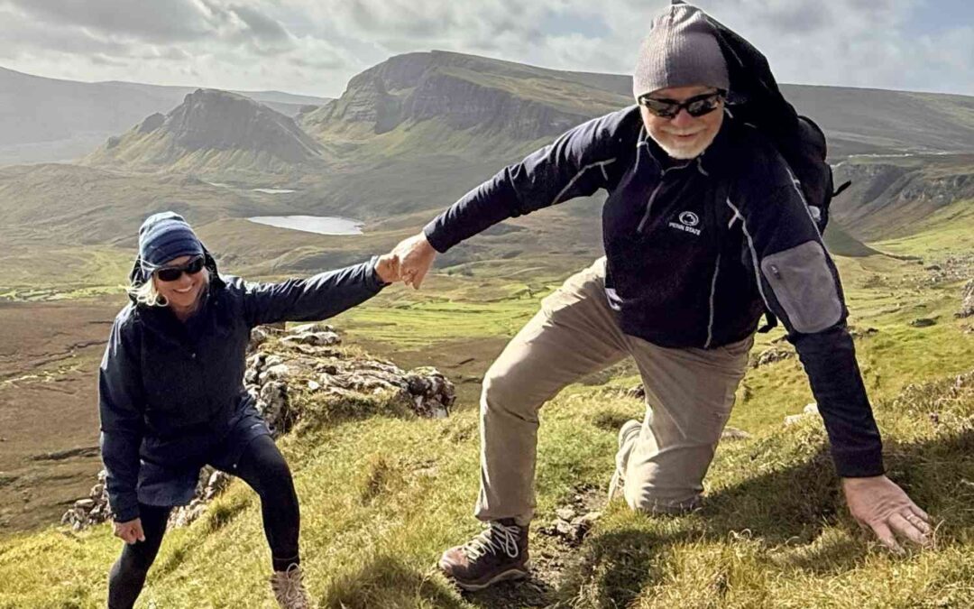 hikers exploring Quiraing trail Isle of Skye